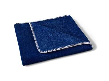 Outdoor Deck Blanket in a dark blue color with a white polo stitch trim