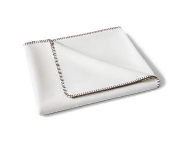 A white outdoor deck blanket with dark brown polo stitch