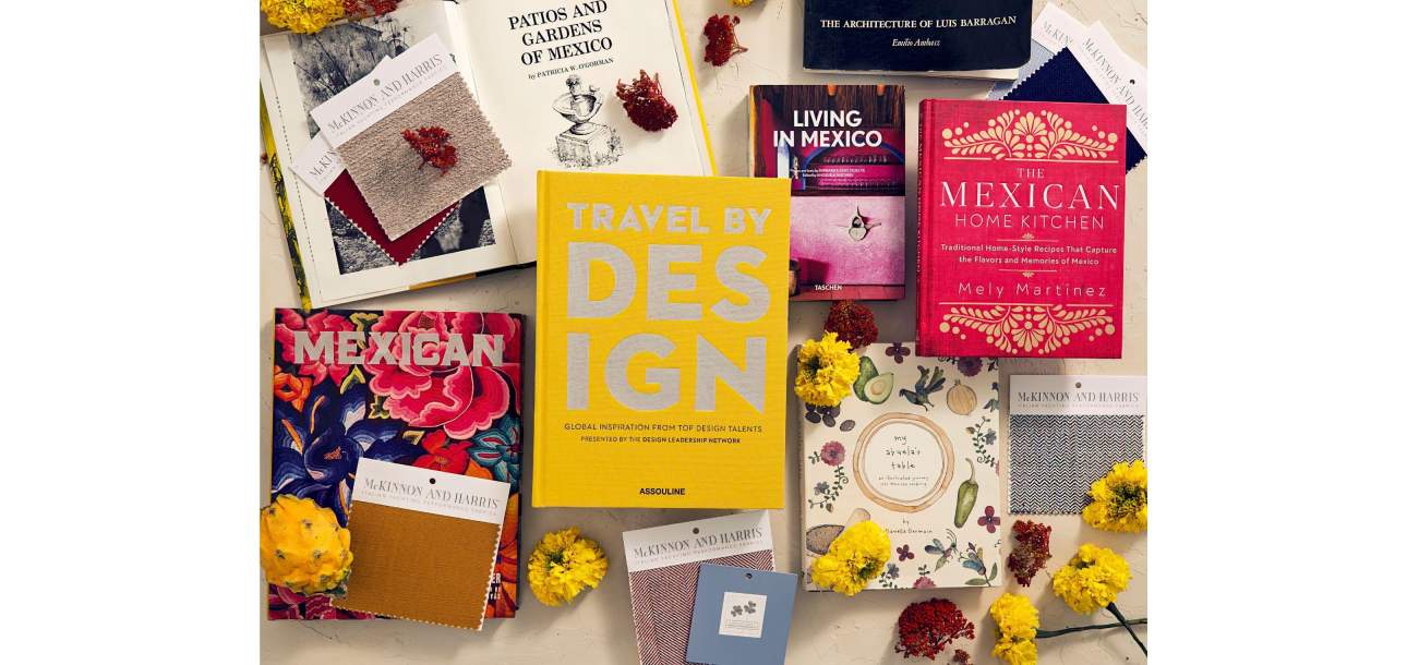 Flat lay of books about Mexico with McKinnon and Harris performance fabric swatches