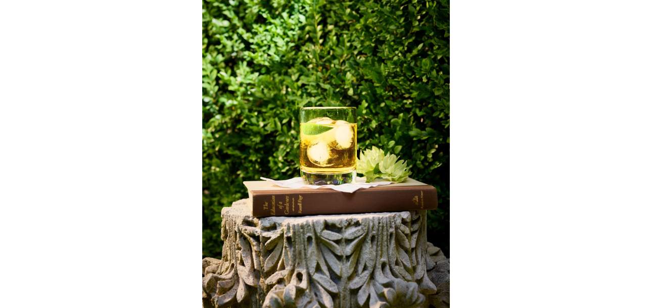 The Education of a Gardener Book with a Ranch Water cocktail on top