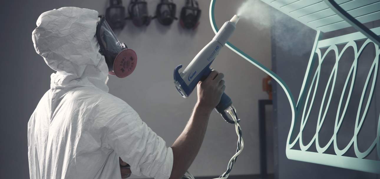 McKinnon and Harris craftsperson powder coating a Virginia Bench
