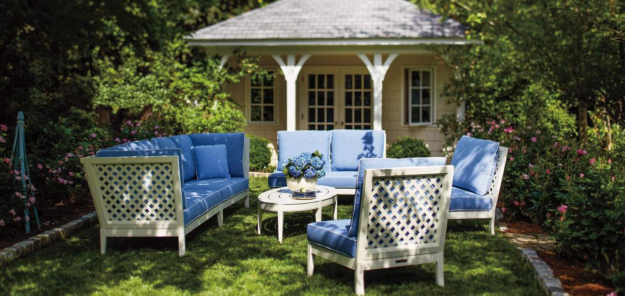 duVal Club Chair and duVal-Alexander Sofa in a backyard garden