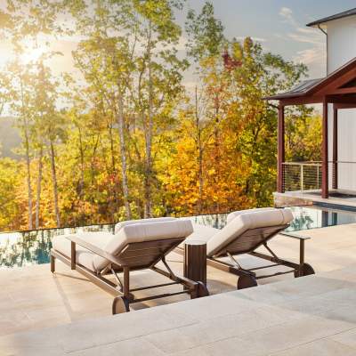 Couper Contrapposto Sun Chaise finished in Jura Peat poolside