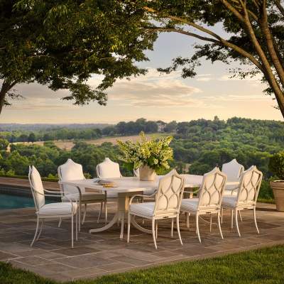 McKinnon and Harris Dining Chairs and Dining Table on a stone terrace overlooking rolling hills
