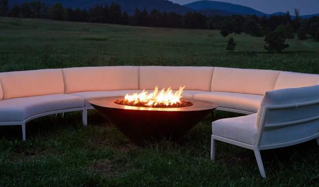 deCamp Lune Sectional around a fire pit at nighttime