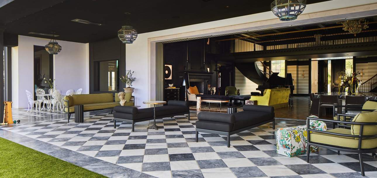 McKinnon and Harris Couper Backless Bench and deCamp Lune Club Chairs at a home in Arizona. Design by House of Turk.