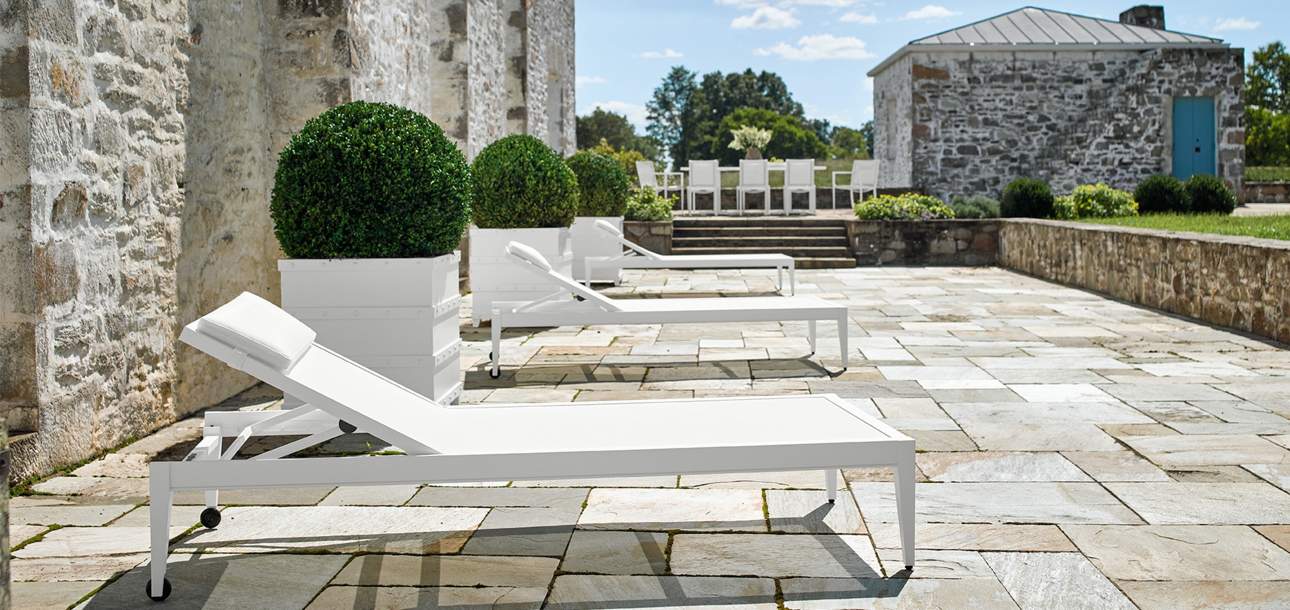 duVal Yacht Sun Chaises on a stone terrace