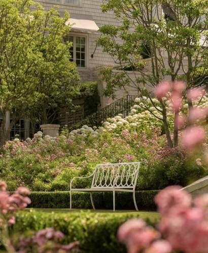 McKinnon and Harris Virginia Bench with Buie Back in a home garden in-bloom. Design by Beth Webb, Landscape Architect by Stephen Hackney, Architecture by Stanley Dixon.