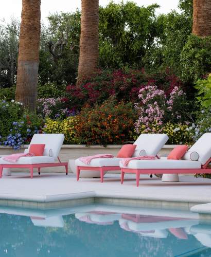duVal Sun Chaises shown in Poinciana Coral with Aeolian Swan Italian Performance Fabric and Piume Scarlet Ibis pillows. Landscape Architecture by Hoerr Schaudt. Photo by Scott Shigley