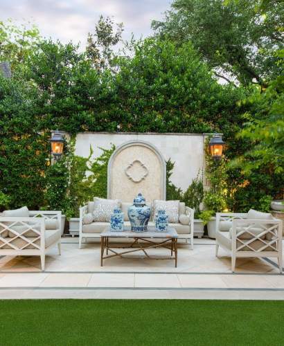 Pavilion VI Club Chairs and Sofa around a coffee table on a stone terrace. Landscape by From The Ground Up Landscape, Photos by Costa Christ