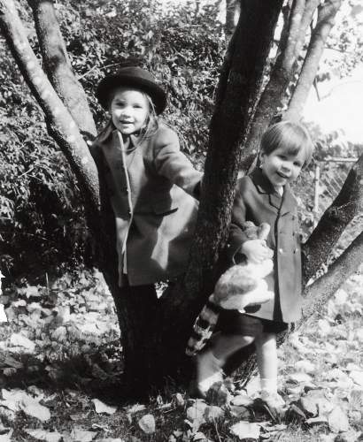 Co-founders Anne and Will playing outdoors as children