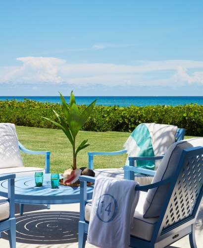 McKinnon and Harris duVal Club Chairs and Wyatt Round Coffee Table finished in Lancaster Blue beach-side