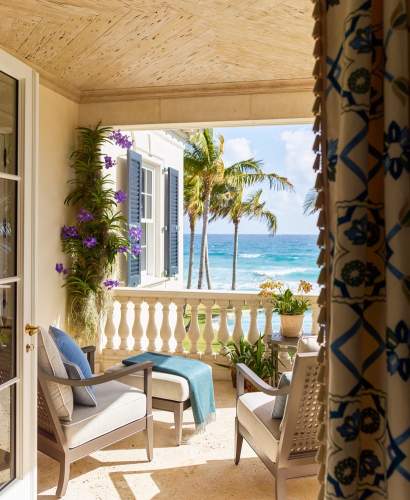 duVal Club Chair on a balcony overlooking the ocean. Design by Cullman & Kravis, Architecture by Peter Zimmerman Architects, Photos by Eric Piasecki/OTTO