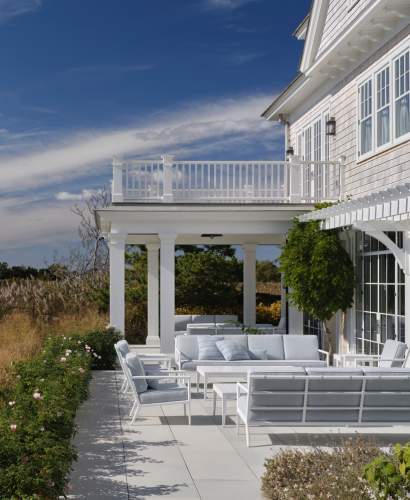 deCamp Sofas and Club Chairs under a Pergola at a home Designed by Victoria Hagan Interiors, Photos by Douglas Friedman