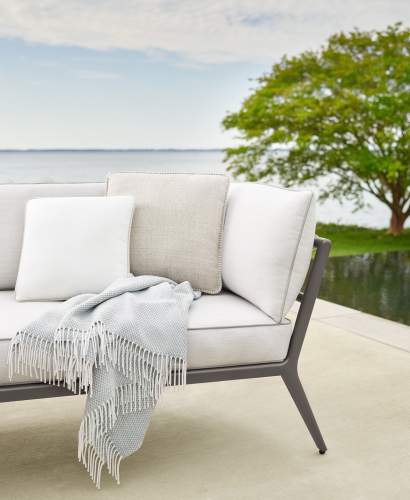 deCamp Sectional Ensemble with throw pillows and deck blanket