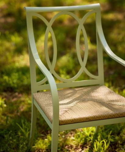 Close-up view of the McKinnon and Harris Buiedining arm chair with Locust Grove Lichen finish and high performance woven rush seat