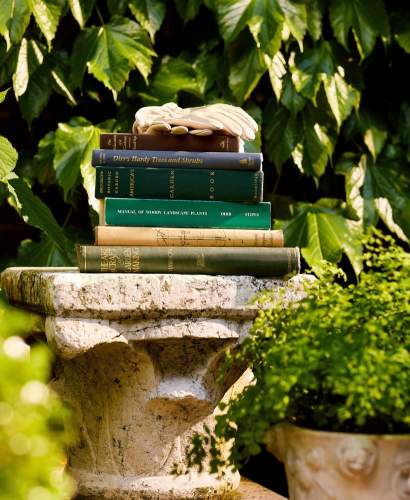A stack of garden inspired books in McKinnon and Harris co-founder Will Massie's garden