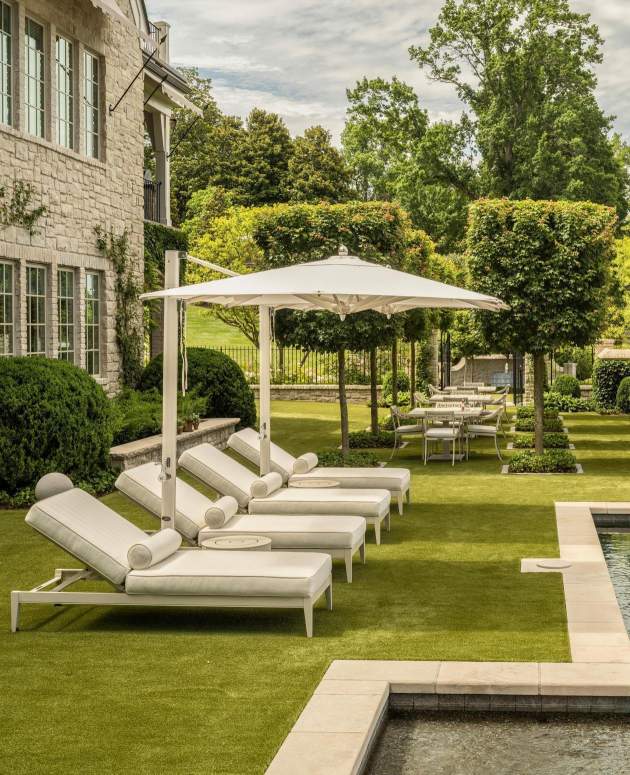 duVal Sun Chaises on the grass poolside. Design by Beth Webb, Landscape Architecture by Stephen Hackney, Architecture by Stanley Dixon, Photo by Lisa Romerein/OTTO