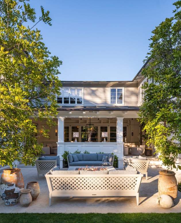 McKinnon and Harris duVal-Alexander Sofa with Trellis Back on a stone terrace. Design by Josh Brown Design, Landscape Architecture by Hoffman & Ospina, Architecture by Domani Architecture, Photo by Manolo Langis