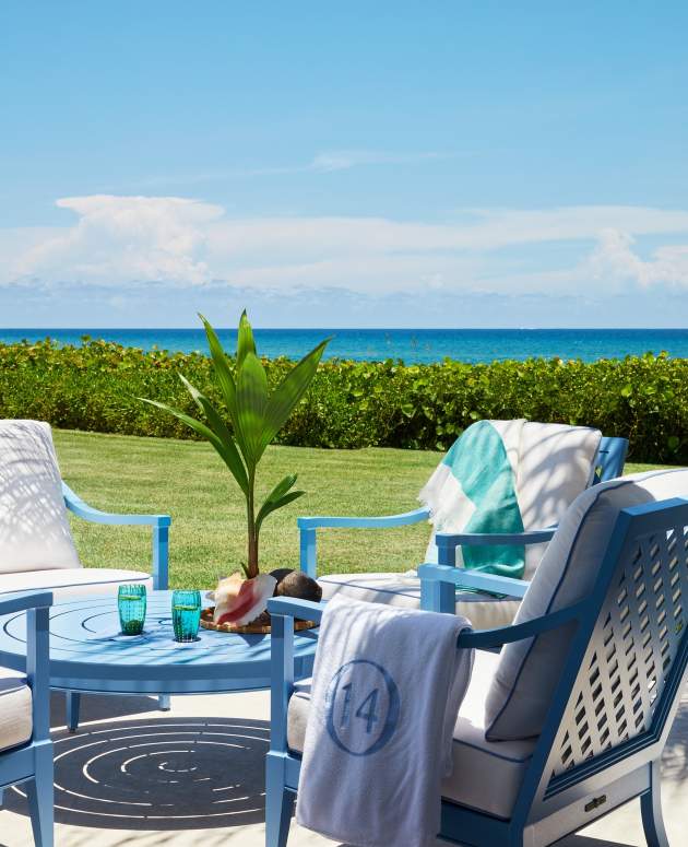 McKinnon and Harris duVal Club Chairs and Wyatt Round Coffee Table finished in Lancaster Blue beach-side