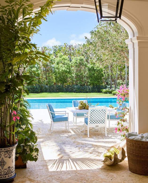 duVal Dining Arm Chairs around a square dining table at a home in Florida. Architecture by Schafer Buccellato Architects, Landscape Design by Cecilia de Grelle, Photo by ©Eric Piasecki/OTTO