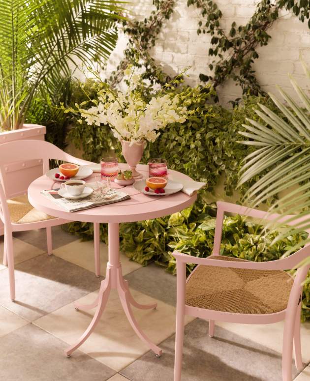 Feolin Round Café Table and Chesapeake Dining Arm Chair with Rush Seat finished in Parigi Pink