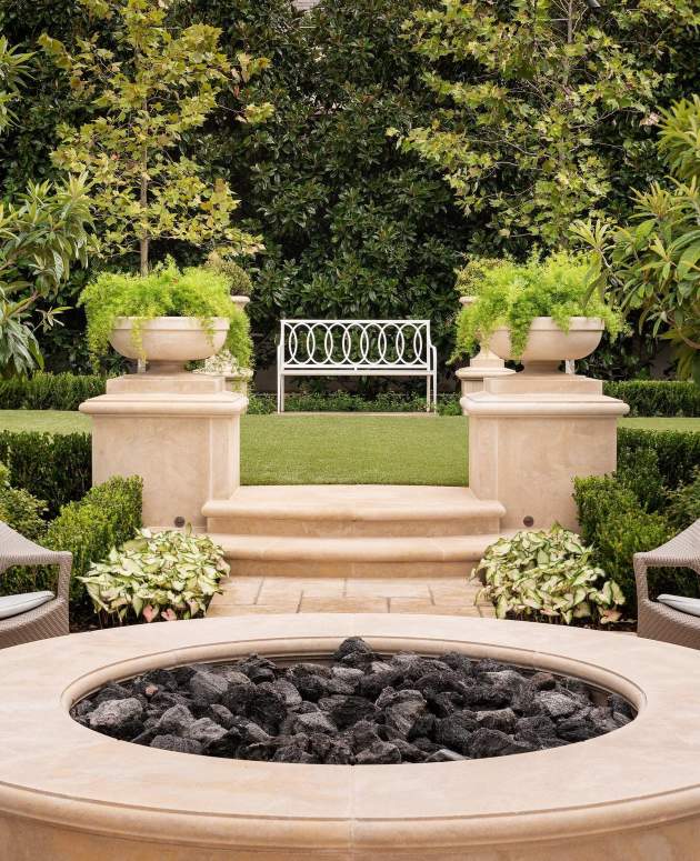 Virginia Bench with Buie Back in a garden at a home in Dallas, Texas. Design by Lara Lee Clark.