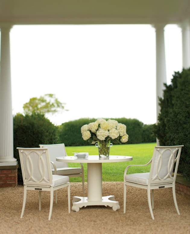 Buie Dining Arm Chairs around a McKinnon and Harris table