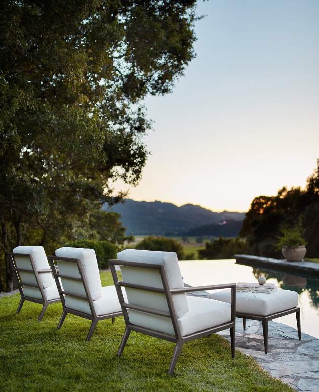 deCamp Club Chair overlooking a pool