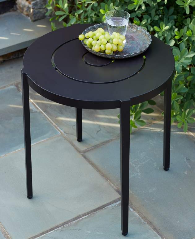 Willis Round Side Table poolside in a dark finish color with grapes and water