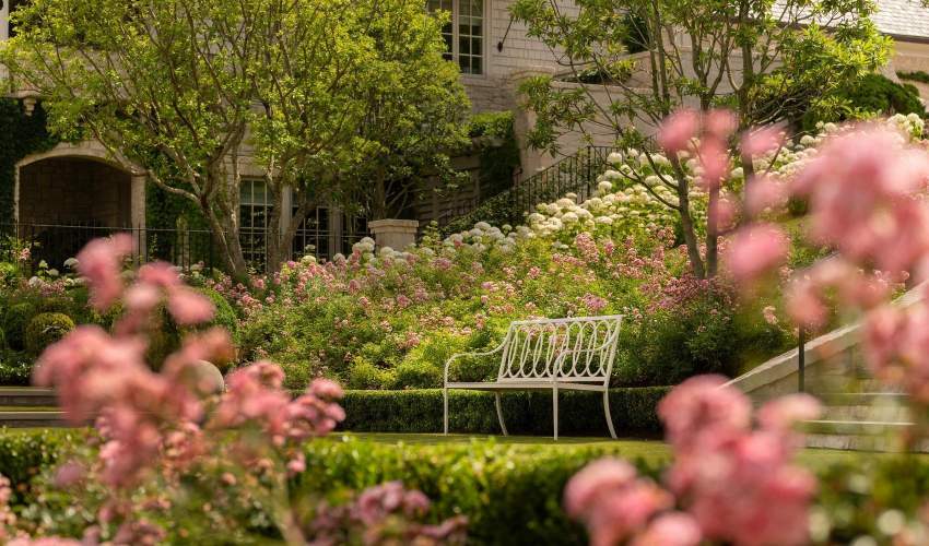 Virginia Bench with Buie Back in a garden. Design by Beth Webb, Landscape Architecture by Stephen Hackney, Architecture by Stanley Dixon, Photo by Lisa Romerein/OTTO