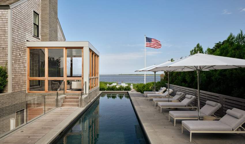 McKinnon and Harris duVal Sun Chaises poolside at a home in Nantucket