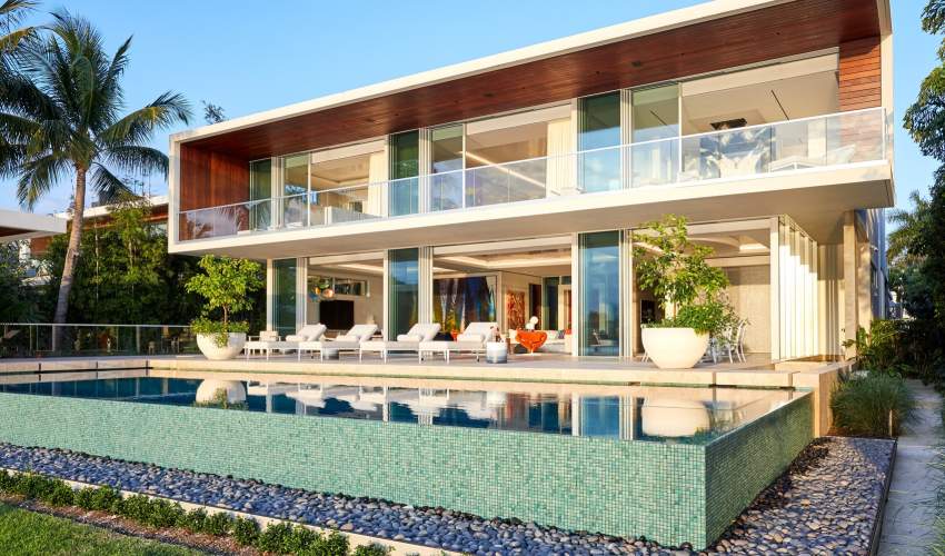 Image of deCamp Sun Chaises poolside at a modern home in Miami. Architecture and Interior Design by Ingrao Inc., Photo by Genevieve Garruppo