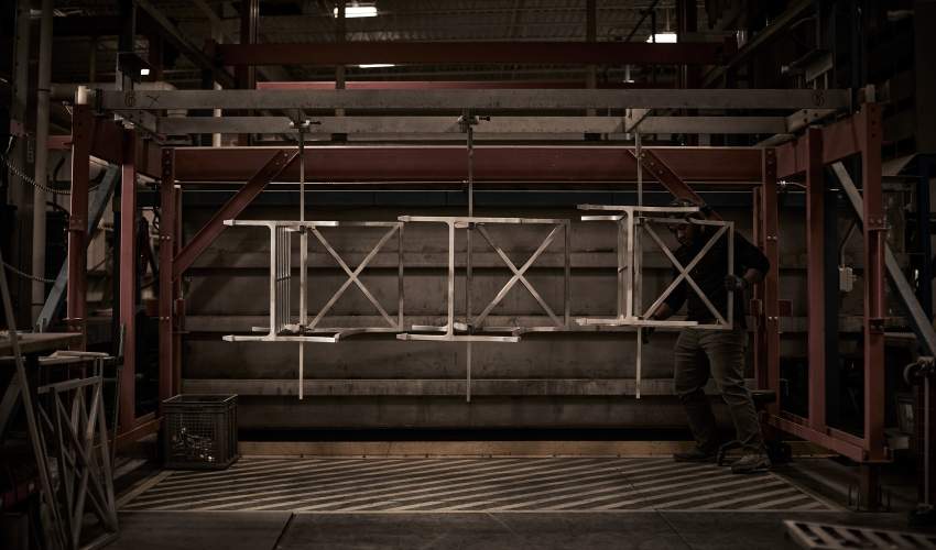 Image of Bonderite EC² Titanium Undercoat craftsmanship process being applied to high-performance furniture frames for maximum longevity. Shown in the McKinnon and Harris Workshop in Richmond, Va