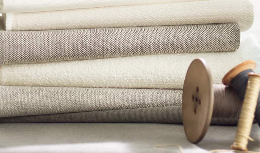 McKinnon and Harris neutral fabrics stacked in a pile