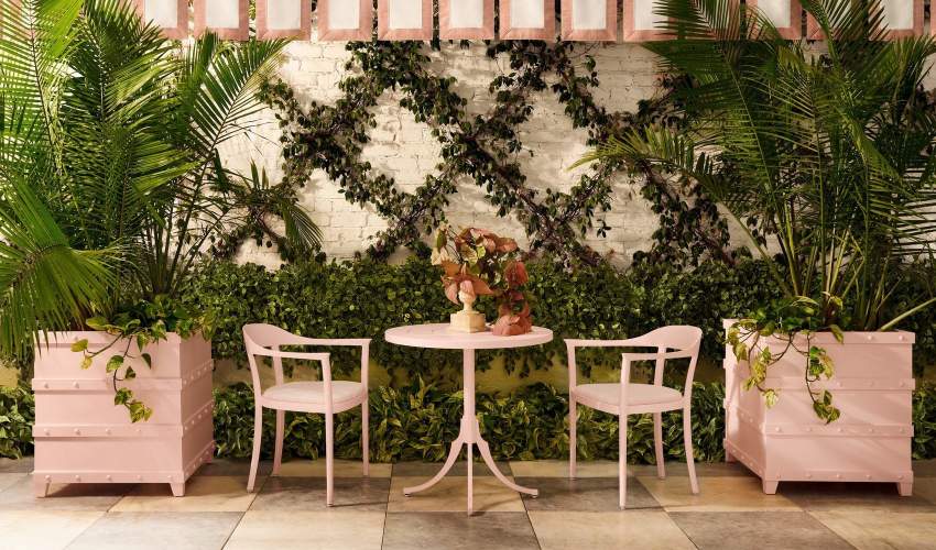 McKinnon and Harris Chesapeake Dining Arm Chairs and Feolin Cafe Table with Palm Boxes on each side. Finished in Parigi Pink