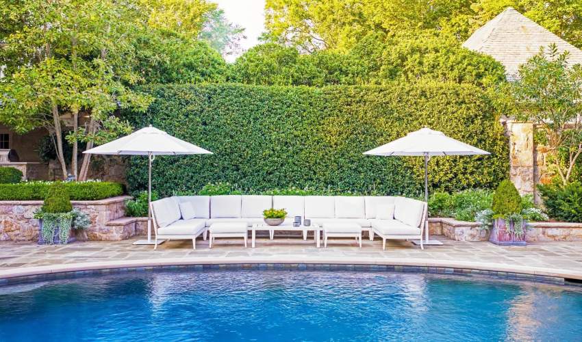 McKinnon and Harris duVal Sectional Ensemble poolside at a home in Charlotte, NC. Design by Suzanne Kasler.