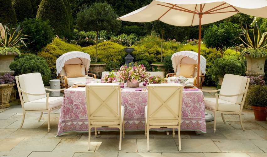 McKinnon and Harris Beaufort Dining Chairs in Charlotte Moss's home garden in East Hampton, NY.