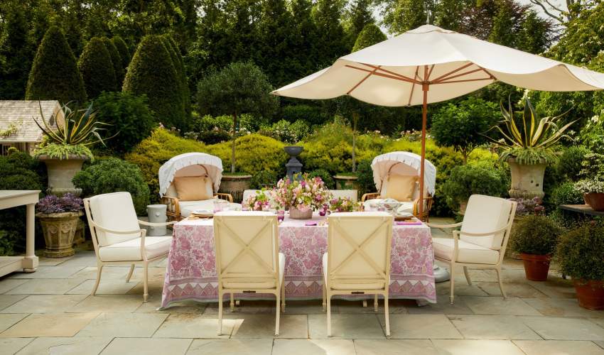 Image of Beaufort Dining Chairs around a large rectangular table. Design by Charlotte Moss, Photo by Trevor Parker