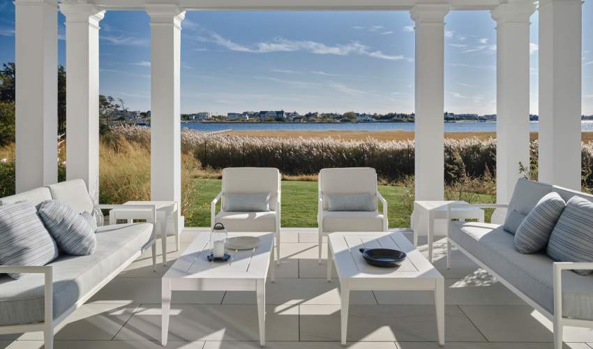 deCamp Sofa and Club Chairs arranged as a seating area under a loggia. Design by Victoria Hagan