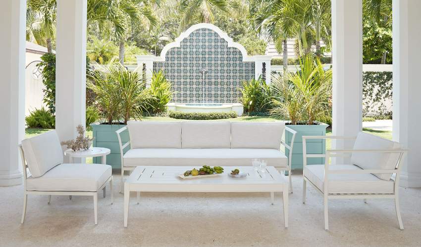 Cowling Sofa and Club Chairs with Wyatt Coffee Table in a Palm Beach backyard