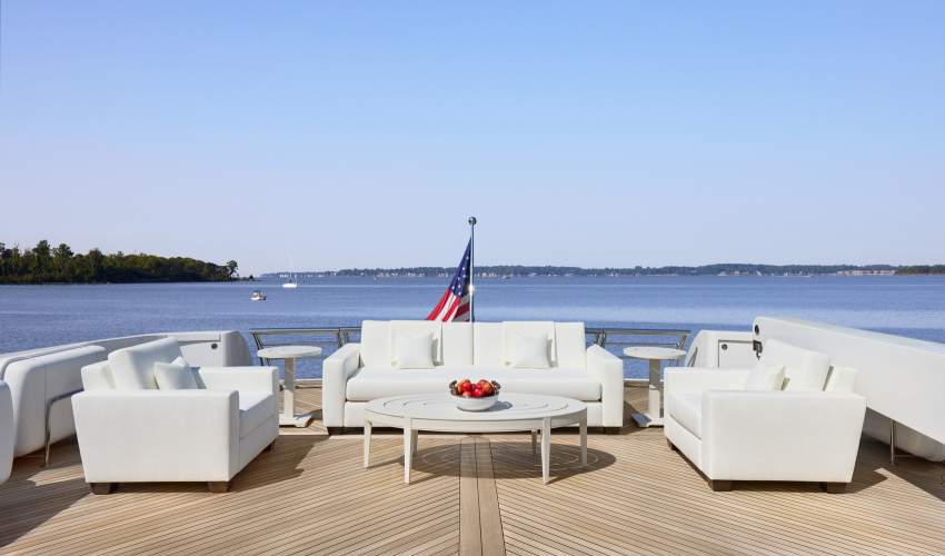 McKinnon and Harris Peristyle Sofa and Club Chairs on a yacht deck overlooking the water