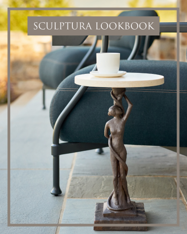 Image of Sculptura Side Table with Natural Stone Top next to a Bastille lounge chair on a stone terrace